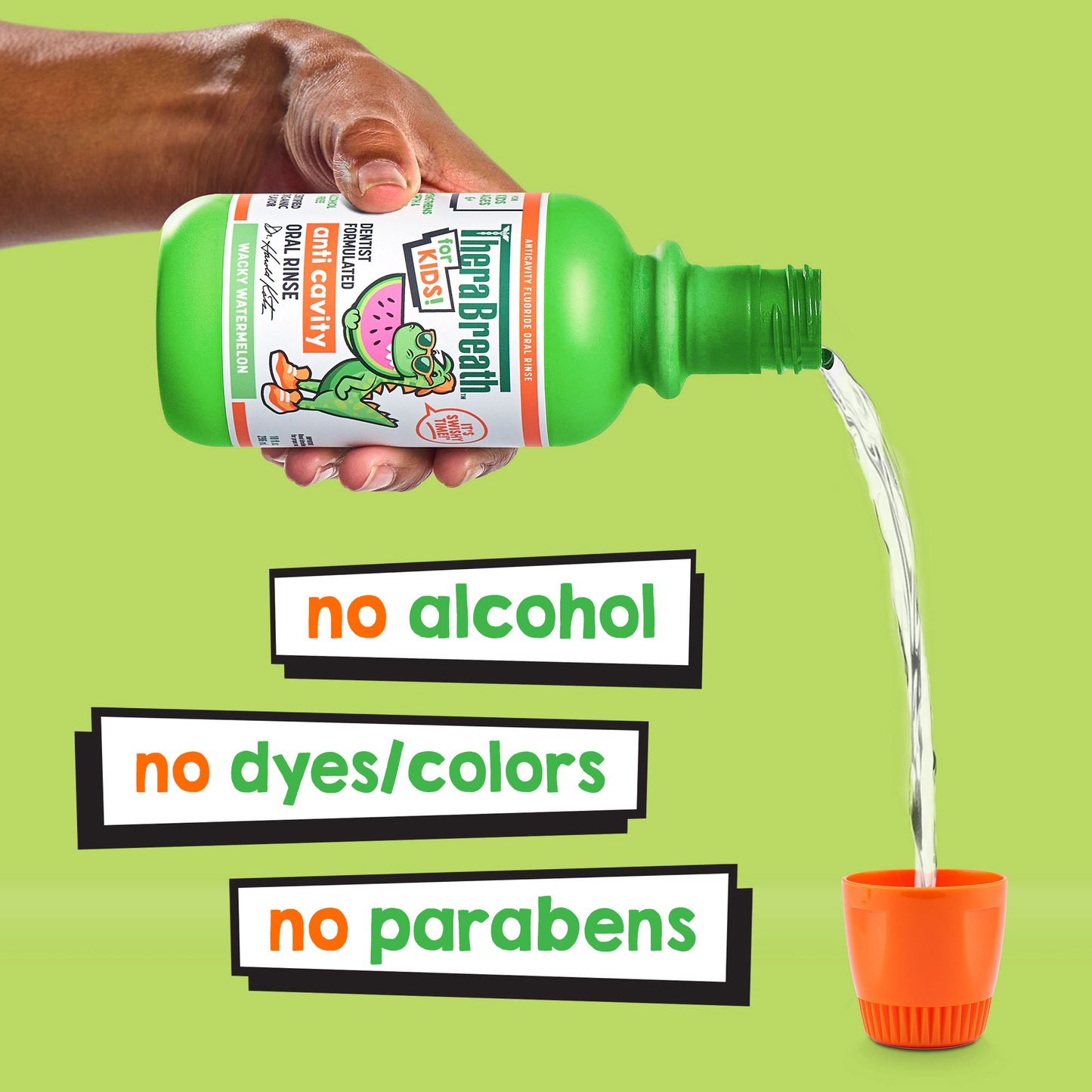 A bright green bottle of TheraBreath for kids Anticavity Oral Rinse in Wacky Watermelon being poured. "No Alcohol, No Dyes/Colors, No Parabens"