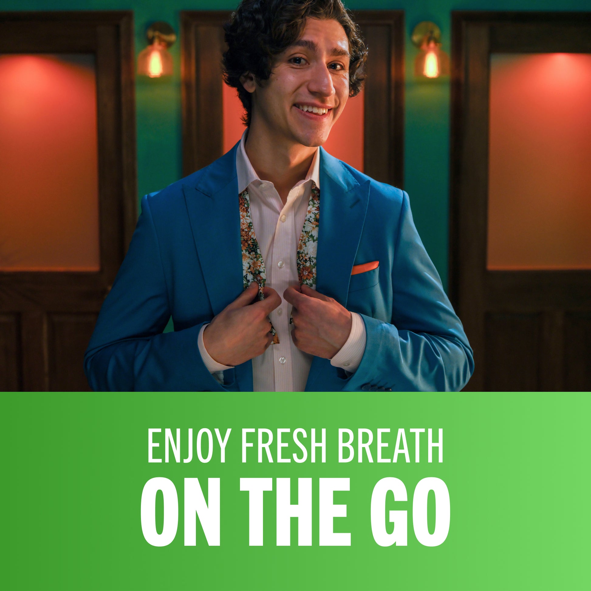 man smiling after using TheraBreath oral rinse with the caption enjoy fresh breath on the go.