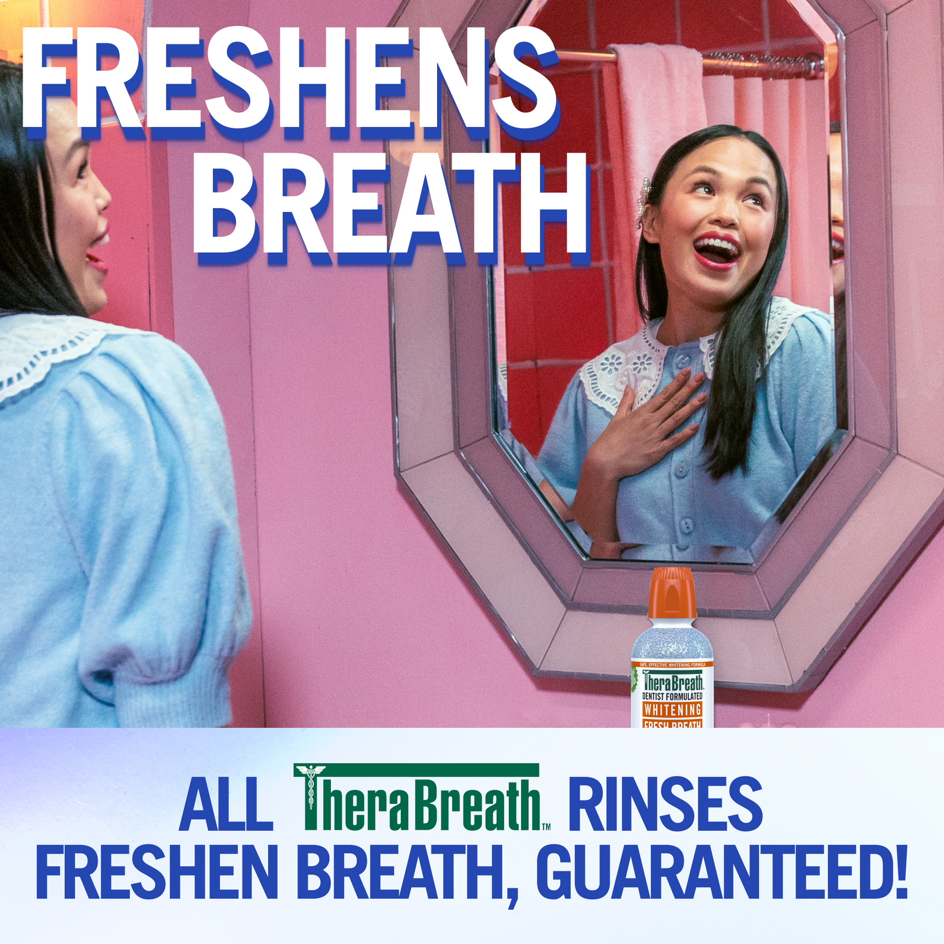 Woman smiling in front of the mirror. The words "Freshens Breath" is at the top of the image, with the caption "All TheraBreath rinses freshen breath, guaranteed!" at the bottom.