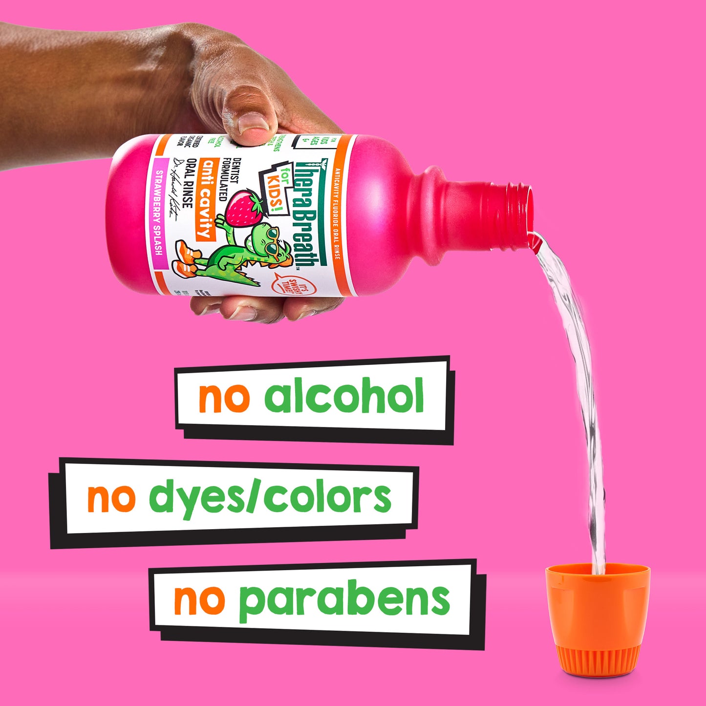 Hand pouring pink bottle of TheraBreath for Kids Anti-Cavity Oral Rinse in Strawberry Splash - featuring no alcohol, no dyes and no parabens