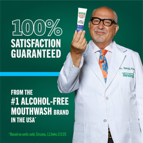 Dr. Harold Katz in a white gown with satisfaction guaranteed banner green background