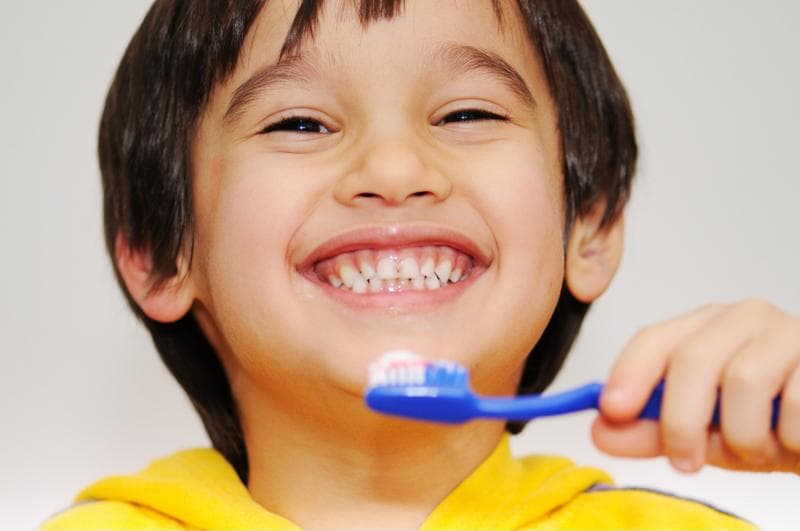Kid smiling before brushing his teeth
