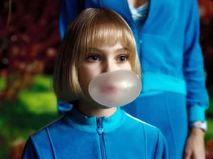 Girl blowing a gum bubble