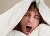 Guy yawning and waking up